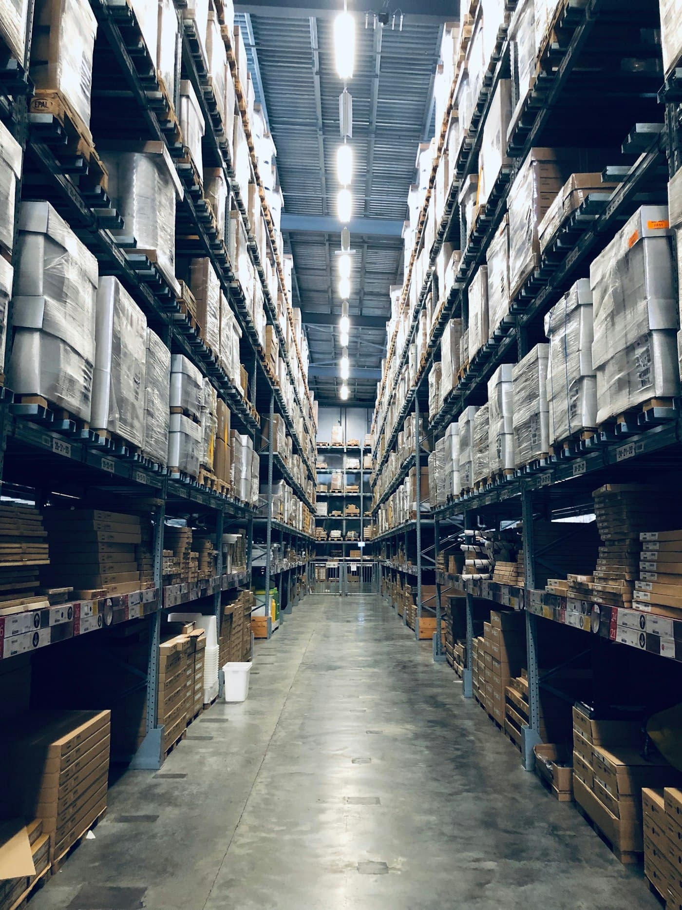 Warehouse workers preparing commercial packages for shipment